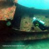 divers looking at wreck